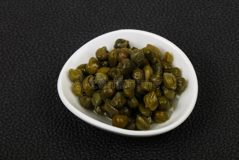 Capers in the bowl stock images