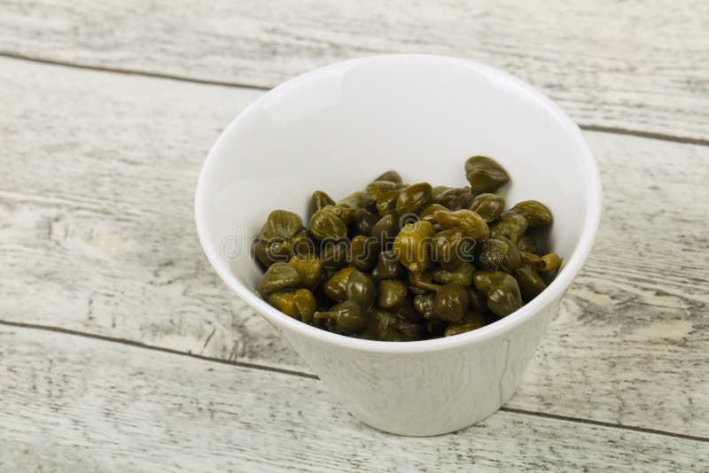Capers in the bowl stock photography