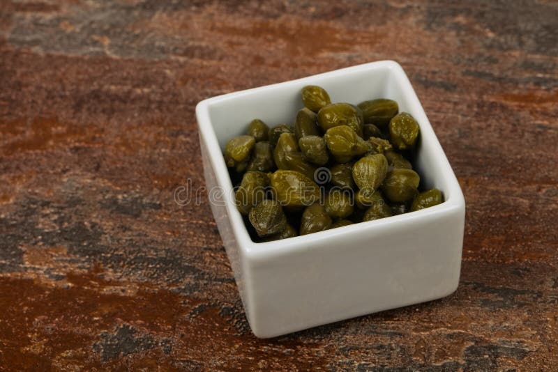 Capers in the bowl stock photos