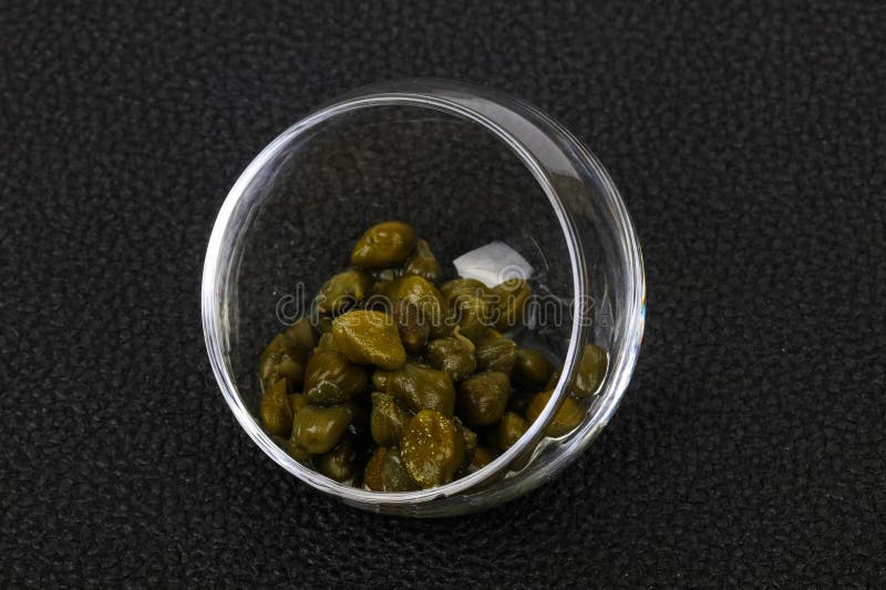 Capers in the bowl stock photos