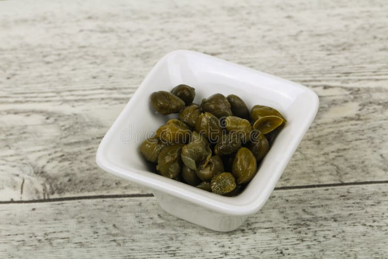 Capers in the bowl stock photography