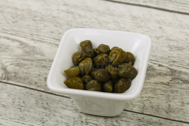Capers in the bowl stock images