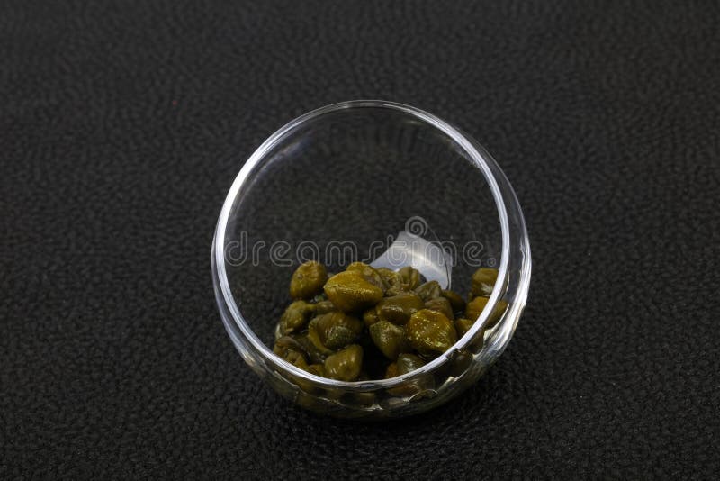 Capers in the bowl royalty free stock photography