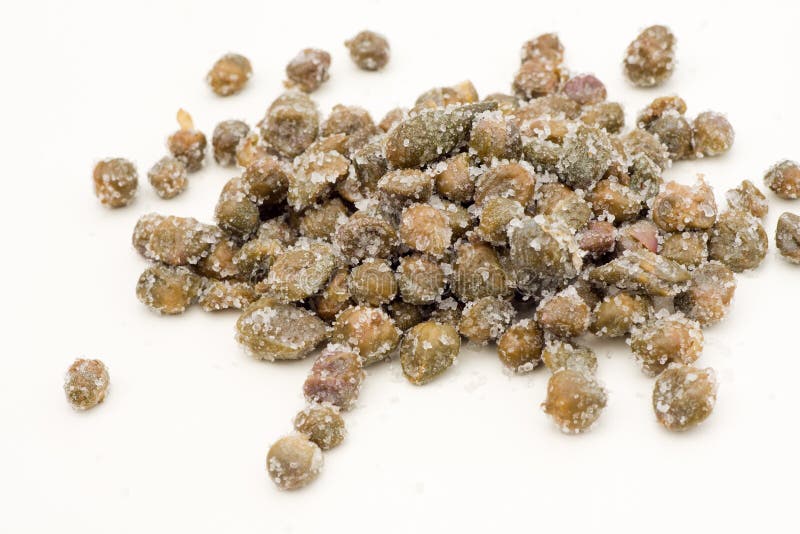 Capers under salt royalty free stock photo