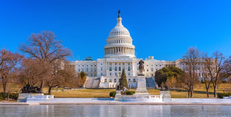 US Capitol over blue sky at winter day. US Capitol over blue sky at winter day