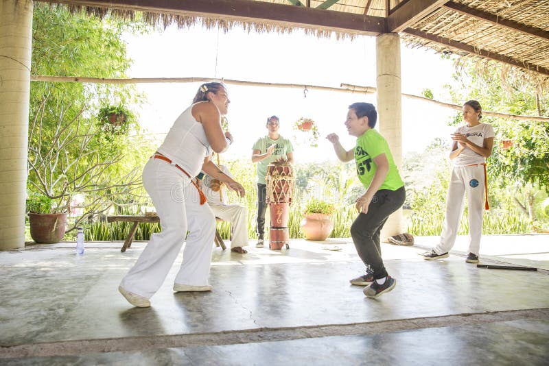 A local group teaches Capoeira, a Brazilian style of dance fighting, at Rancho Tierra Madre in Puerto Vallarta, Jalisco, Mexico. A local group teaches Capoeira, a Brazilian style of dance fighting, at Rancho Tierra Madre in Puerto Vallarta, Jalisco, Mexico