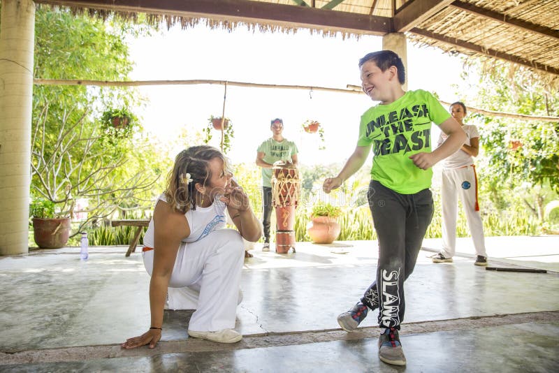 A local group teaches Capoeira, a Brazilian style of dance fighting, at Rancho Tierra Madre in Puerto Vallarta, Jalisco, Mexico. A local group teaches Capoeira, a Brazilian style of dance fighting, at Rancho Tierra Madre in Puerto Vallarta, Jalisco, Mexico