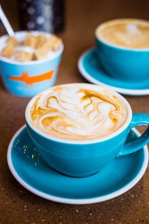 https://thumbs.dreamstime.com/b/cappuccino-big-blue-cups-modern-vegan-cafe-drink-cappuccino-big-blue-cups-modern-vegan-cafe-158937080.jpg