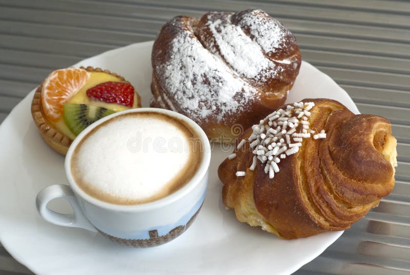Breakfast with cappuccino and pastry. Breakfast with cappuccino and pastry