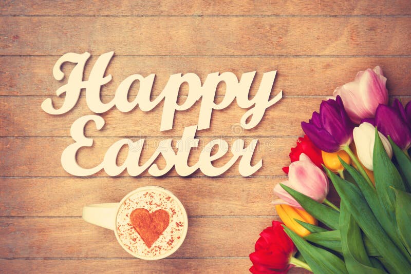 Cappuccino and words Happy Easter near flowers stock image Cappuccino and words Happy Easter near flowers stock image