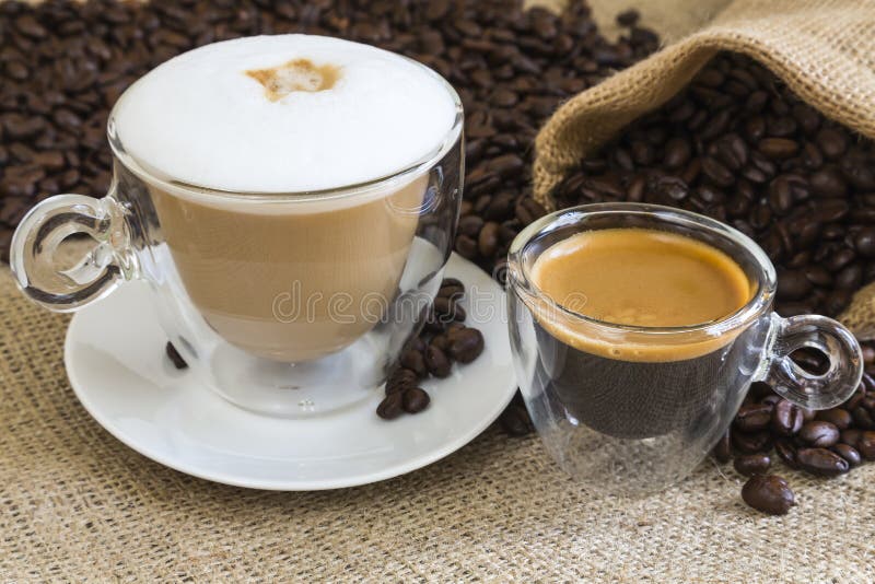 Fresh cappuccino and espresso in transparent glassy cups. Fresh cappuccino and espresso in transparent glassy cups