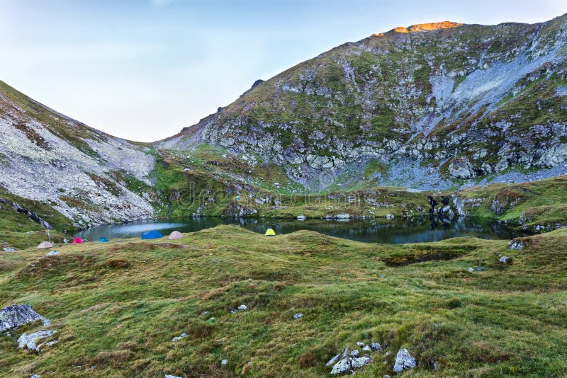 Capra lake in Fagaras mountains Romania. Capra & x28;Goat& x29; lake in Fagaras mountains in Romania, with a lot of hiking tents royalty free stock photography Capra lake in Fagaras mountains Romania. Capra & x28;Goat& x29; lake in Fagaras mountains in Romania, with a lot of hiking tents royalty free stock photography
