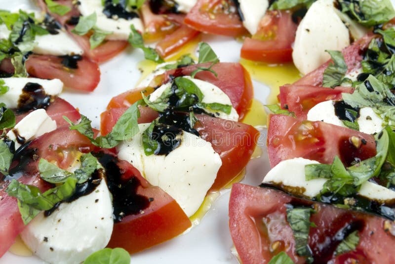 Caprese Salad. Sliced Tomatoes, Mozzarella and Shredded Basil Stock ...