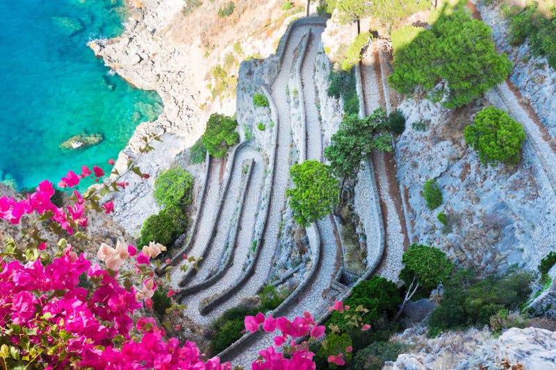 Via Krupp stairs to sea with flowers, Capri island, Italy