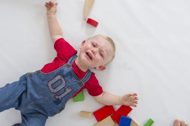 A baby boy throws himself onto his back while having a tantrum!. A baby boy throws himself onto his back while having a tantrum!