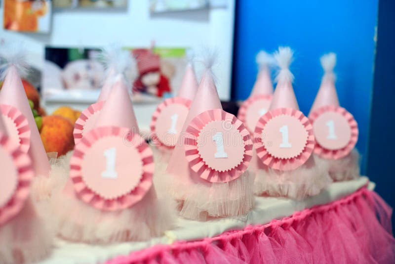 Caps to celebrate the first birthday. Concept birthday party, ch royalty free stock photography Caps to celebrate the first birthday. Concept birthday party, ch royalty free stock photography