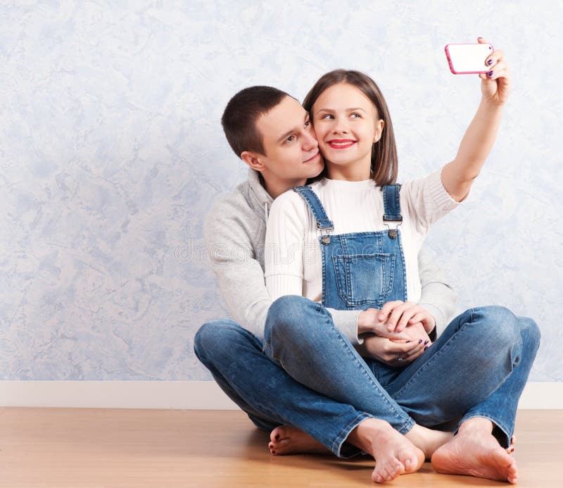 Capturing a happy moment. Happy family celebrate new year. Portrait loving  family. lot of xmas present boxes. merry christmas. Father and mother love  kids. small children and parents in santa hat Stock