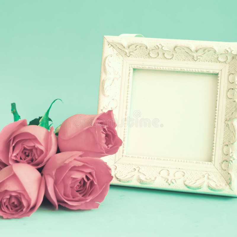 Vintage white wooden frame and roses. Vintage white wooden frame and roses