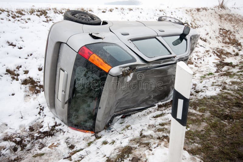 Car flipped upside down in accident during winter storm. Car flipped upside down in accident during winter storm