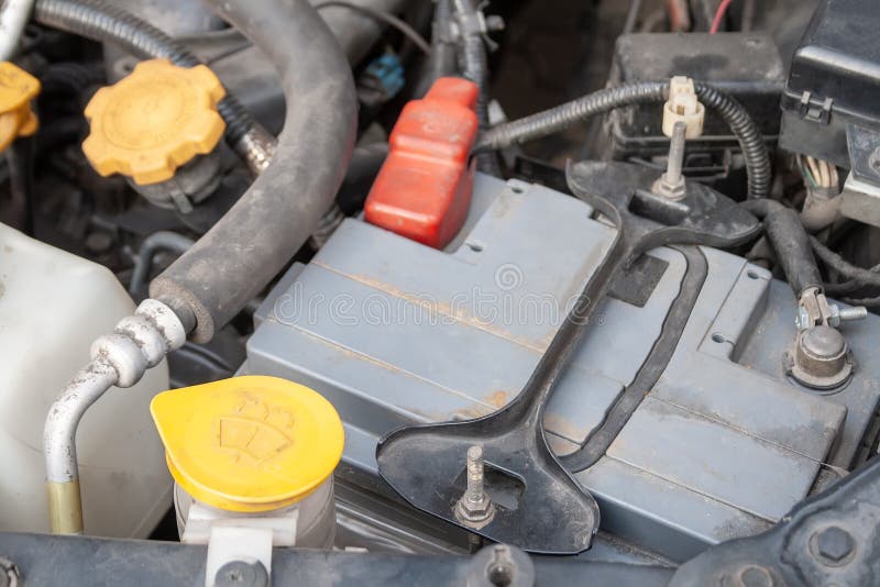 Car battery and windshield washer. Close up detail of a Flat-four car engine compartment under the open hood royalty free stock photography Car battery and windshield washer. Close up detail of a Flat-four car engine compartment under the open hood royalty free stock photography
