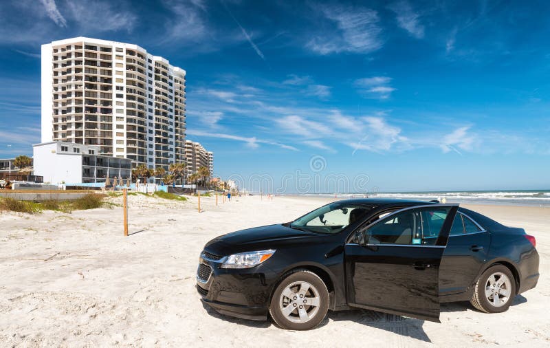 Car on the Beach, Daytona Beach Skyline and Oceanfront. Holiday Stock