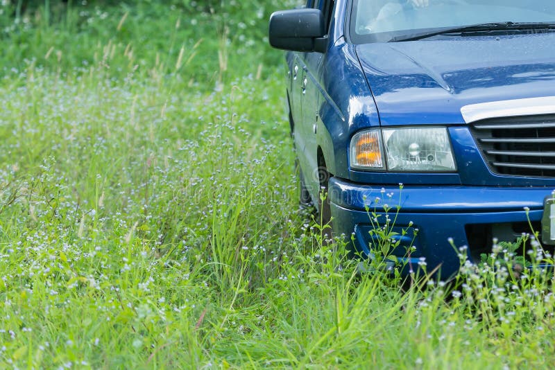 Car blue in the grass,Driving in the grass, Car Drivin in the countryside.