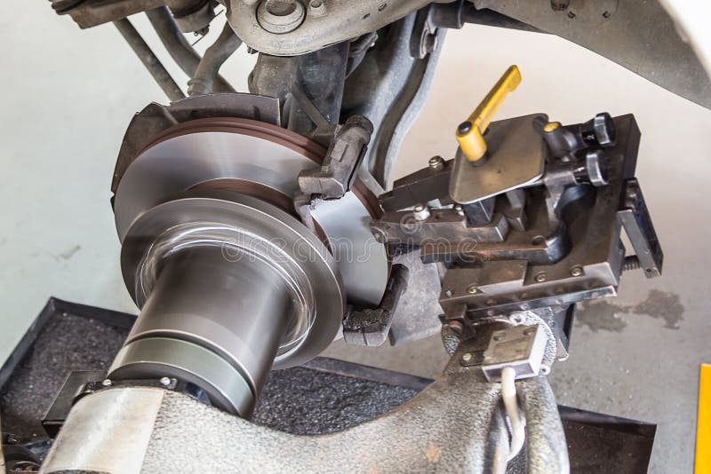 Brake Lathe Tool Polishing Disc Brakes of Cars Working Stock Photo