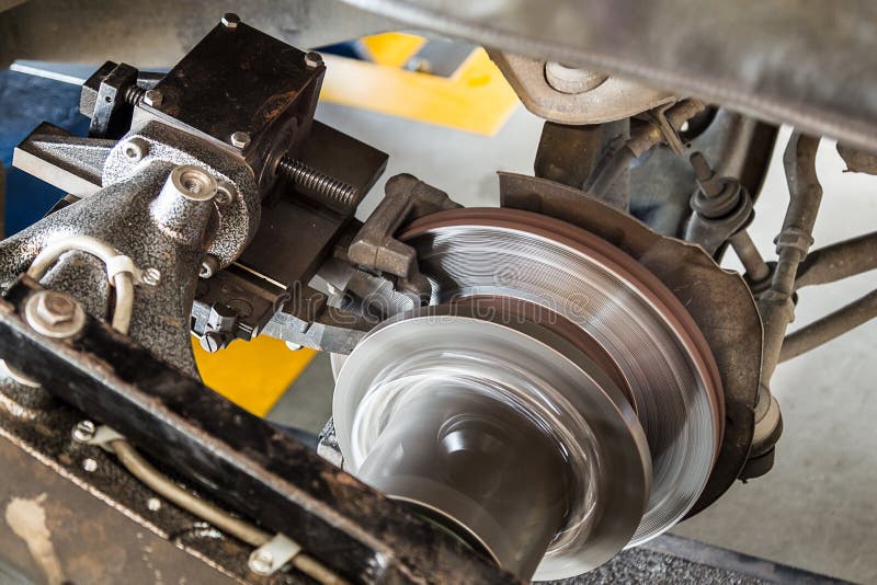 Brake Lathe Tool Polishing Disc Brakes of Cars Working Stock Photo