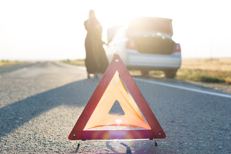 Car Breakdown on the Road, Warning Sign on the Asphalt Stock Photo