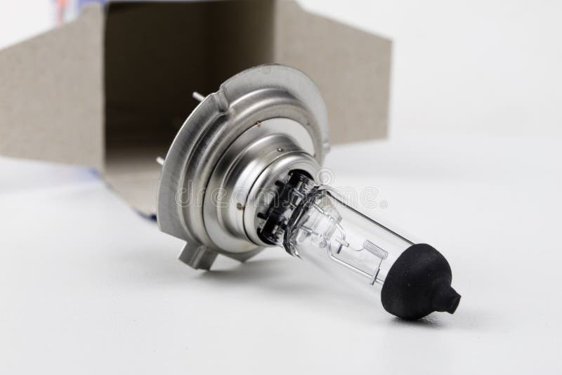Car Bulb on a White Table. Electric Car Accessories. Stock