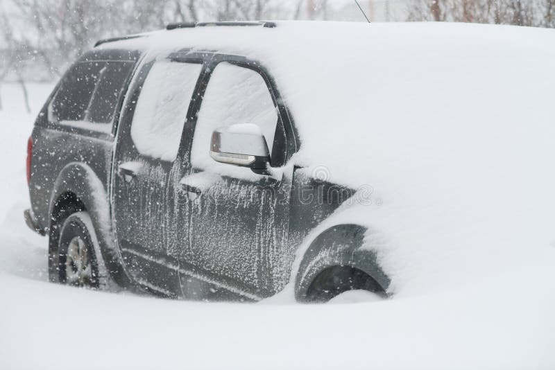 Car buried in snow