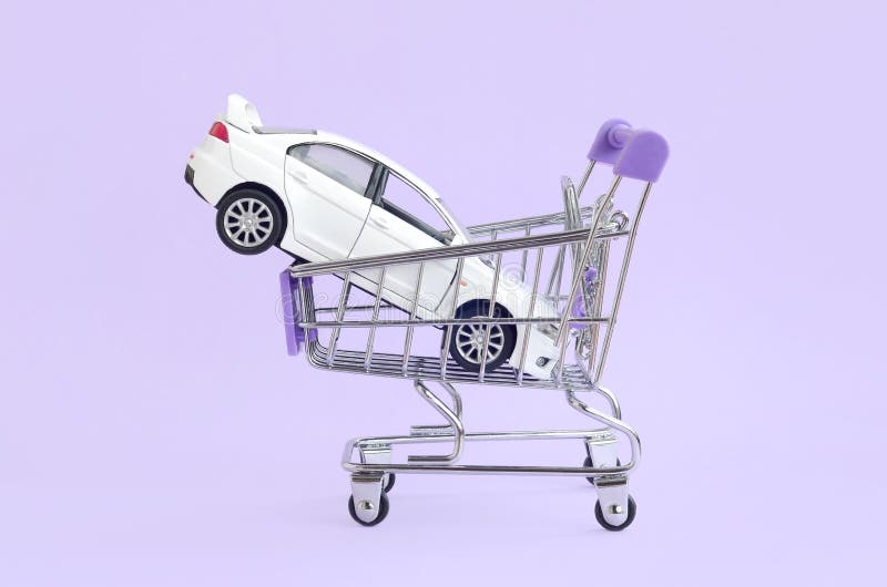 Car buying and leasing concept. Vehicle in shopping cart stock photos Car buying and leasing concept. Vehicle in shopping cart stock photos
