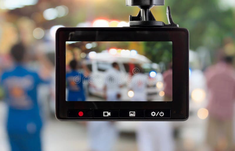 Car CCTV Camera Video Recorder with Ambulance Car on the Road Stock