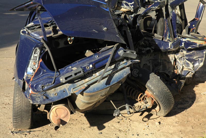 The car crash on the road. Passenger car is completely broken. Fatal traffic accident. A car destroyed in an accident that cannot be repaired and is turned stock image The car crash on the road. Passenger car is completely broken. Fatal traffic accident. A car destroyed in an accident that cannot be repaired and is turned stock image