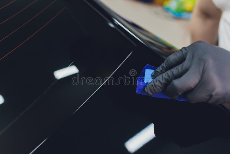Car Detailing Man Applies Nano Protective Coating To the Car