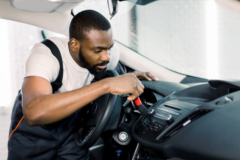 Carwash, Worker Cleans Salon with Steam Cleaner Stock Image