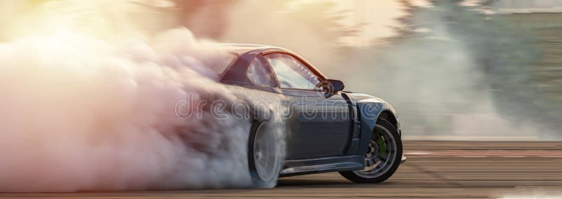 Car drifting, Blurred  image diffusion race drift car with lots of smoke from burning tires on speed track.
