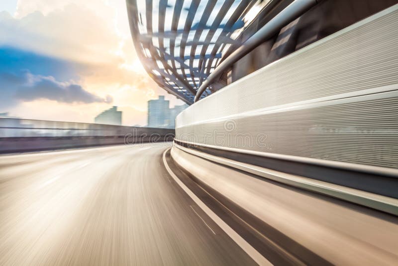 Car driving on road in city background, motion blur