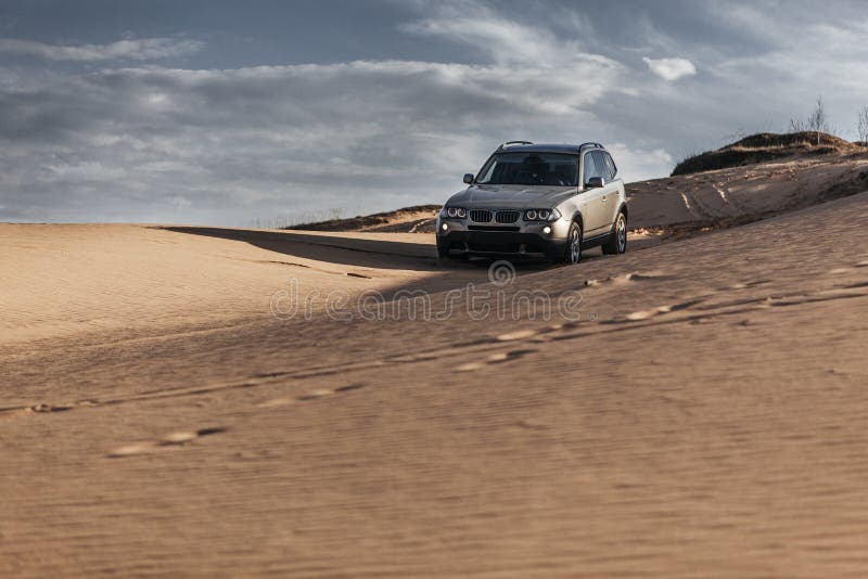 Car Driving through Sand Dune Stock Image Image of hill, emirates