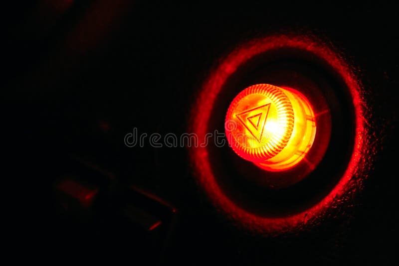 Car emergency button at night - as danger symbol stock images