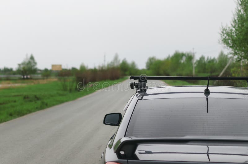 Car on the empty asphalt road in the cloudy rainy day. Car on the empty asphalt road in the cloudy rainy day.