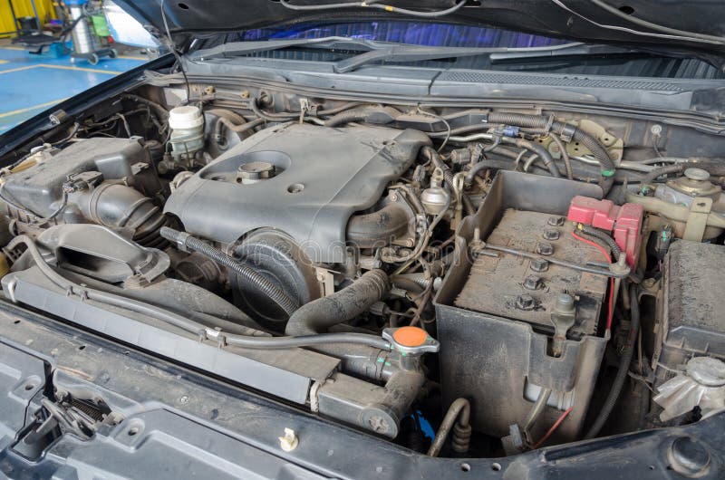 Dirty Engine Compartment In The Used Car, Visible Parts Of The Engine