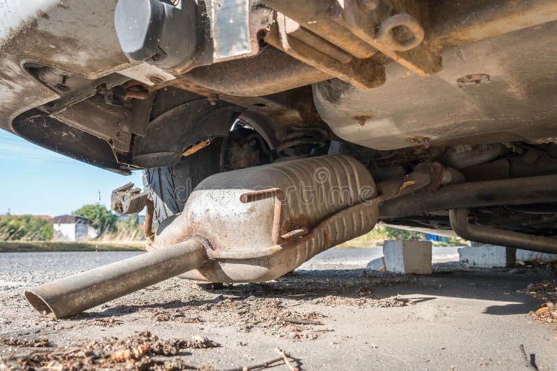 car-exhaust-muffler-fallen-off-car-forgotten-car-street-concept-car-exhaust-muffler-fallen-off-car-forgotten-car-street-206846201.jpg