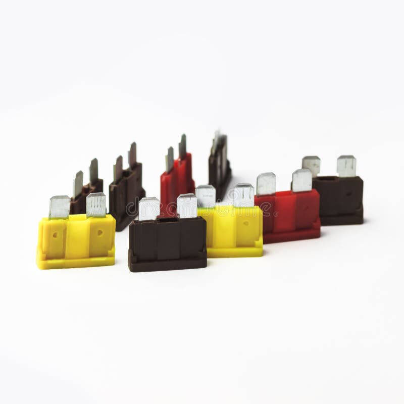 Car Fuse. Red, Yellow, Dark. Closeup. on a White Background Stock