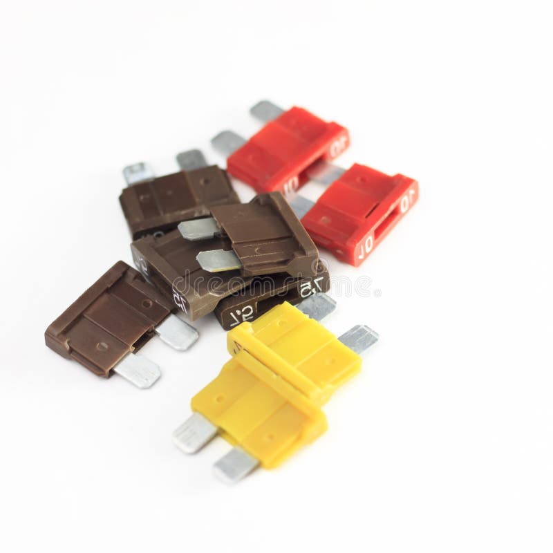Car Fuse. Red, Yellow, Dark. Closeup. On A White Background Stock