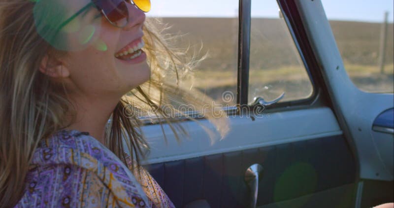 Car, happy and woman on road trip for travel, sun and summer holiday, relax and freedom in countryside. Smile, girl and