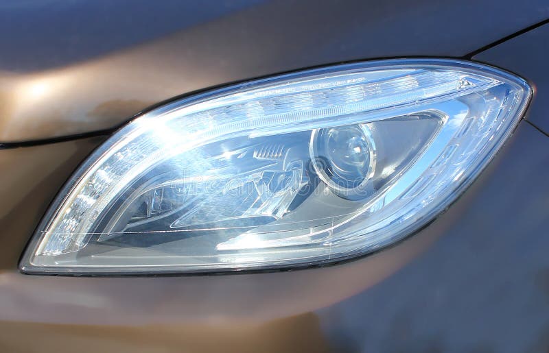 Car Headlight. Lights the Road at Night when Driving Stock Image
