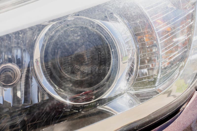 Car headlight, scratches stock image. Image of metal 187368739