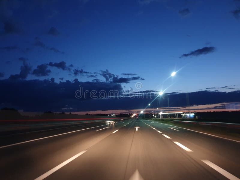 Car Headlights Illuminate the Night Highway, Dangerous Nighttime