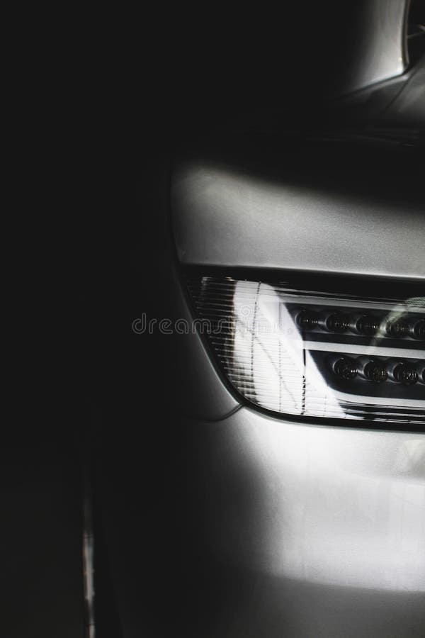 Car Headlights. Part of the Car in the Shade Stock Photo Image of